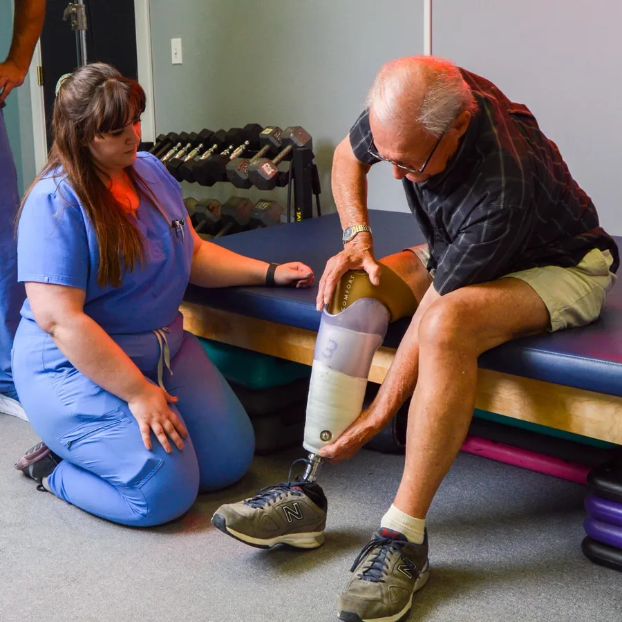 A Bremer prosthetist fitting a patient with a new prosthesis